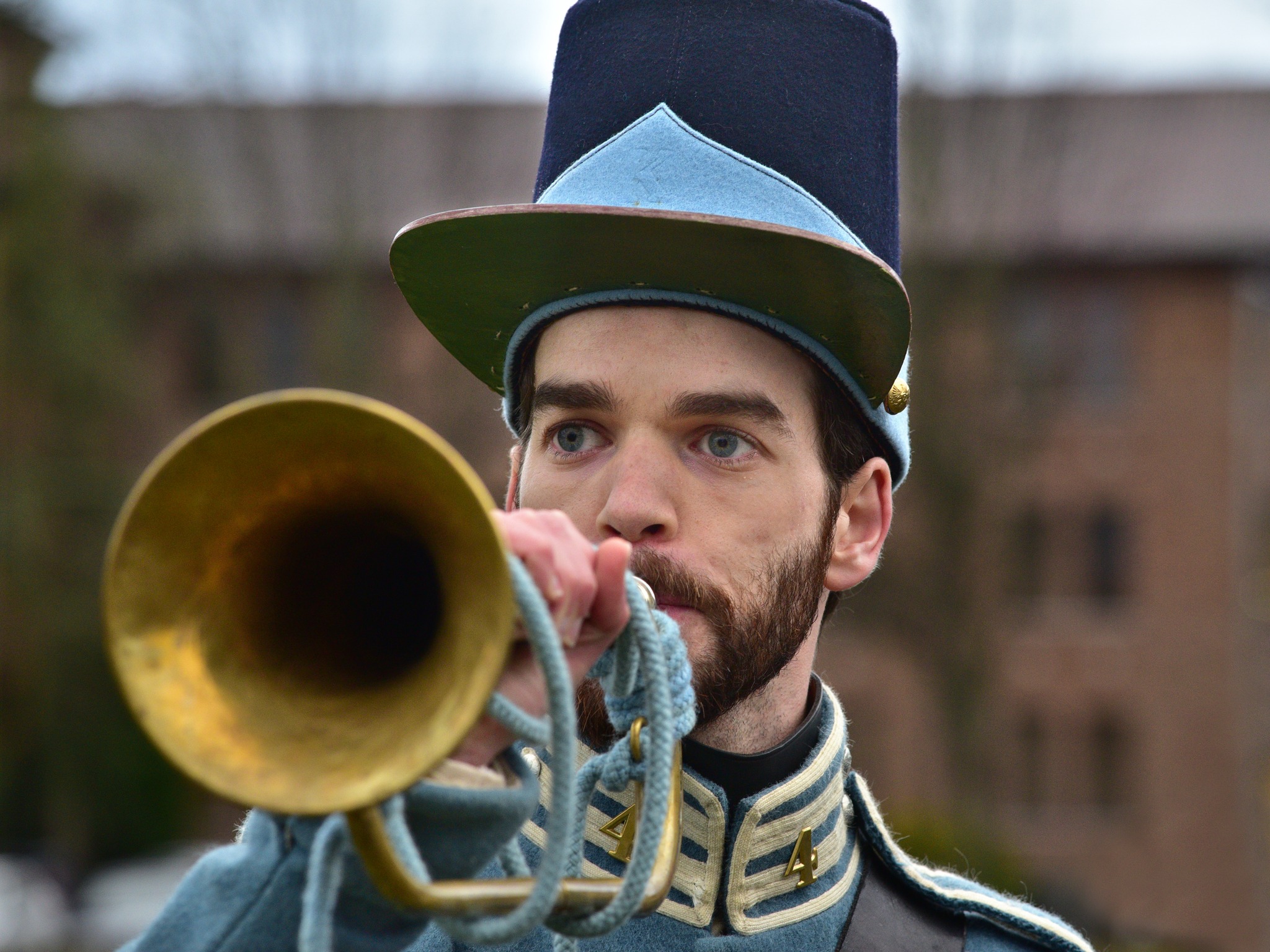 reenactor blowing a bugle
