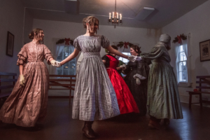 re-enactors dancing at a holiday ball